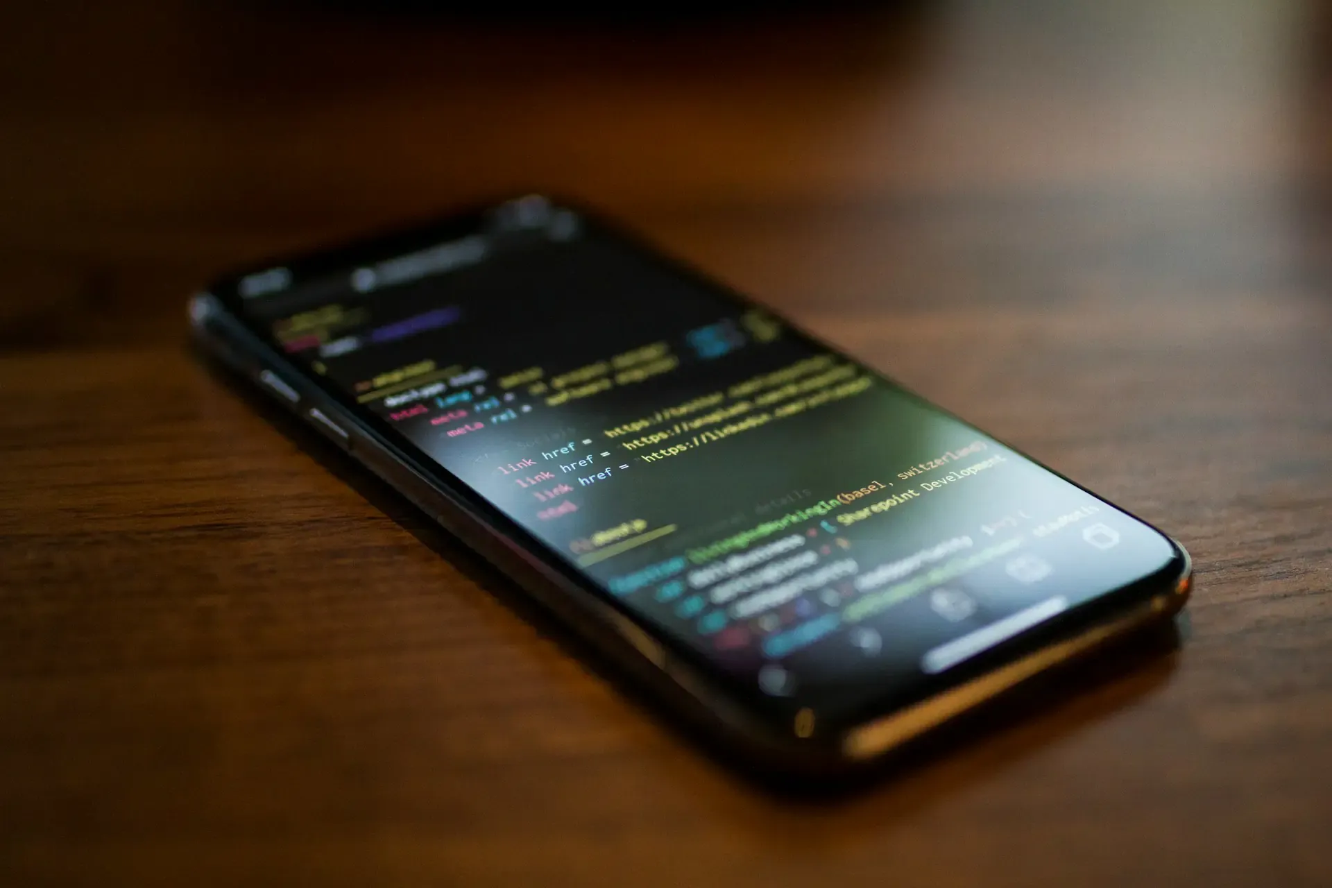 Developer working on mobile IoT application code